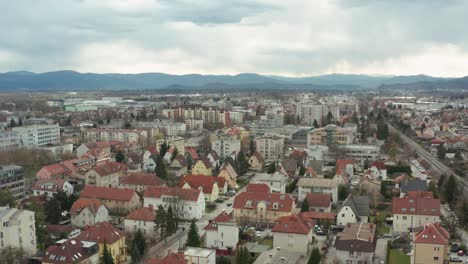 Aerial-truck-shot-over-the-capital-of-Slovenia,-Ljubljana,-on-an-overcast-day