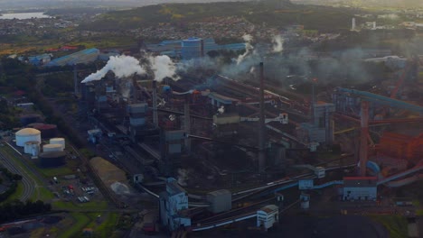 Smoke-Rising-From-Steel-Factory-in-Wollongong-Australia---aerial-shot