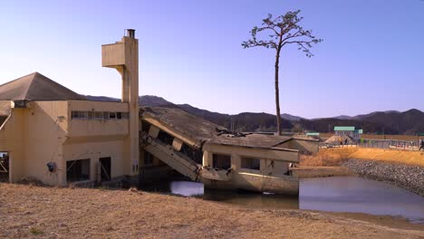 Tourists-looking-at-destroyed-building-at-Iwate-Tsunami-Memorial-museum