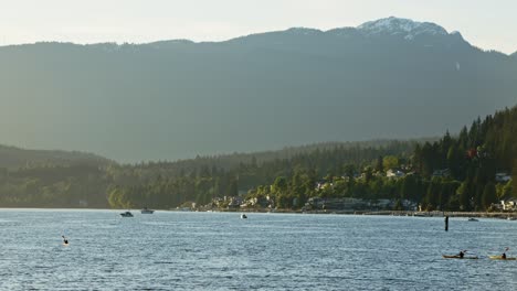 Kayaker-and-speed-boat-and-nature-in-Port-Moody