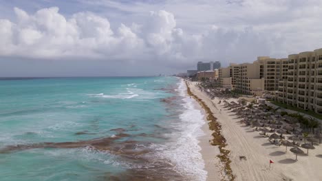 Aerial-view-showing-cityscape-of-Cancun-with-famous-resort-city-by-Caribbean-Sea---landscape-panorama-of-from-above,-Mexico,-Central-America,-4K