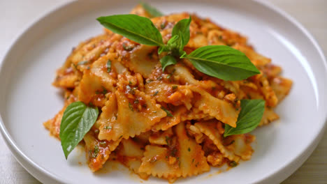 farfalle-pasta-with-basil-and-garlic-in-tomato-sauce---Italian-food-style