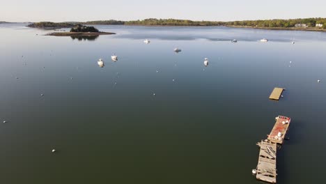Beautiful-cinematic-aerial-shot-flying-over-boats-moored-in-Hingham-Harbor