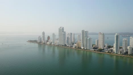 Long-Establishing-Drone-Flight-Above-Cartagena,-Colombia-on-Beautiful-Caribbean-Day