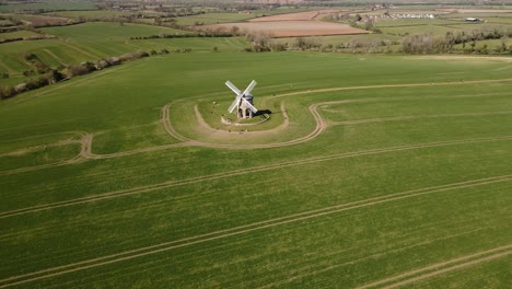 Landmark-Chesterton-historic-windmill-wide-aerial-view-orbit-right-across-English-rural-countryside-farmland-landscape