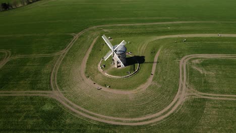 Chesterton-Windmill-listed-building-aerial-birdseye-orbit-left-view-over-picturesque-English-rural-countryside-agricultural-field