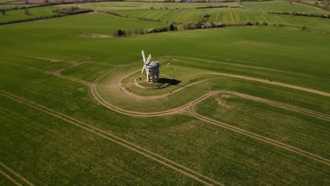 Landmark-Chesterton-historic-windmill-distant-aerial-view-overflying-English-rural-countryside-farmland-to-Birdseye
