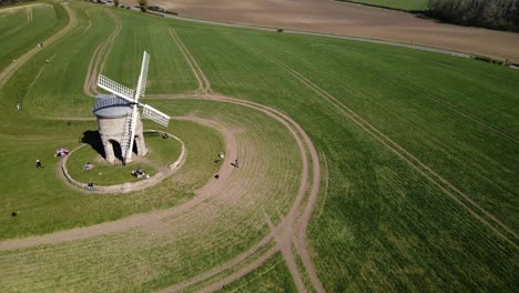Landmark-Chesterton-historic-windmill-aerial-orbit-right-view-across-English-rural-countryside-agricultural-field
