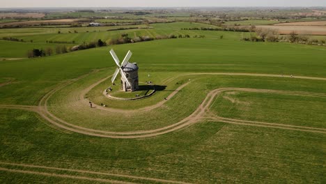 Landmark-Chesterton-historic-windmill-aerial-view-orbit-right-across-English-rural-countryside-agricultural-field-landscape
