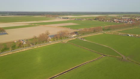 High-above-rural-cow-farm-ranch-in-Dutch-countryside,-aerial