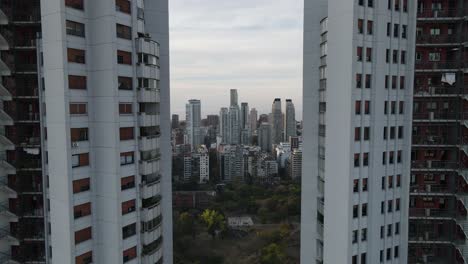 Cinematic-aerial-backwards-flight-beside-Twin-Towers-showing-skyline-of-Buenos-Aires,Argentina