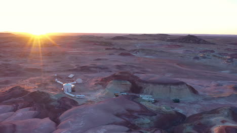 Sunbeams-at-sunrise-illuminating-Mars-Research-Station-area,-Hanksville