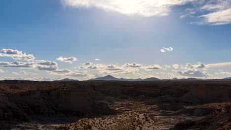 As-time-passes,-clouds-and-shadows-crawl-across-the-rugged-terrain-of-Red-Rock-Canyon-in-the-Mojave-Desert---stationary-time-lapse