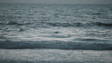 Slomo-gimbal-shot-of-sea-waves-during-sunset