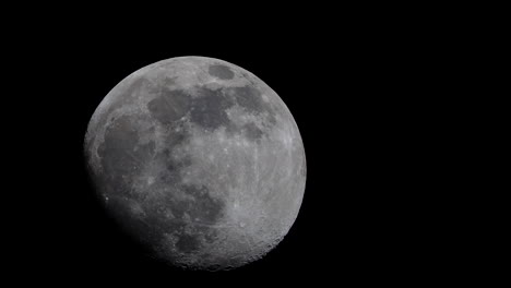 The-moon-in-its-waxing-gibbous-phase,-crosses-the-night-sky-in-spectacular-detail---time-lapse
