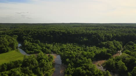 Aerial-shot-of-a-creek-in-the-countryside-of-Tennessee