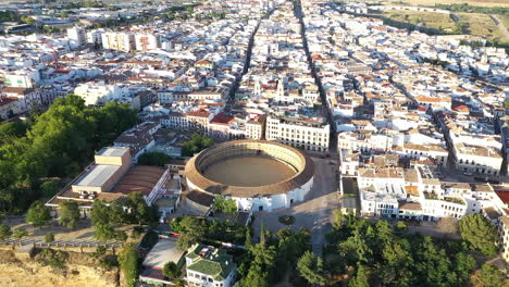 AERIAL---Bullfighting-ring-in-Ronda,-Malaga,-Spain,-wide-shot-tilt-down
