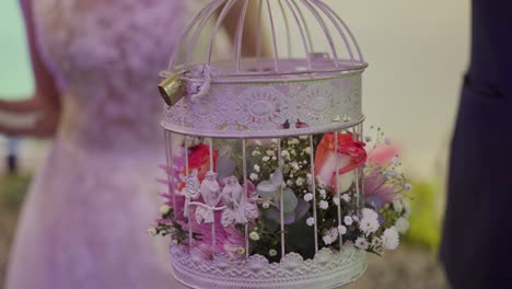 cage-with-bridal-bouquet-inside
