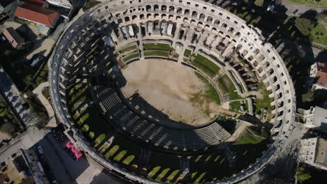 Drone-spinning-over-roman-arena-in-Pula,-Croatia,-amphitheater