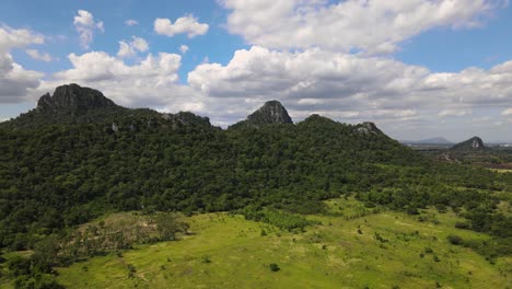 An-Aerial-Drone-Footage-of-Hillside-with-trees-and-rocks-in-Lopburi-Province,-Thailand
