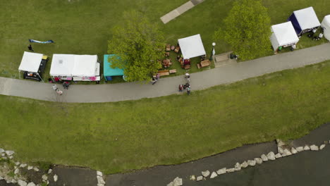 AERIAL---Booths-during-Dogwood-Festival,-Siloam-Springs,-Arkansas,-top-down-view