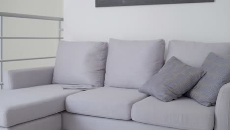gray-armchair-with-two-cushions-in-living-room