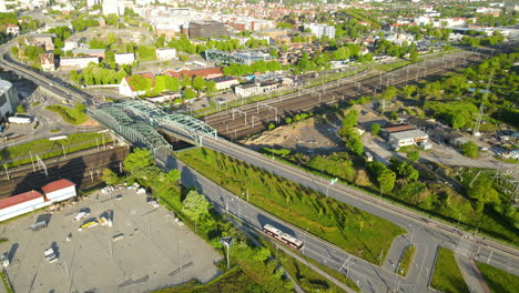 Aerial-View-Of-Truss-Bridge-Over-Railroad-Of-Trains-In-Gdansk,-Poland