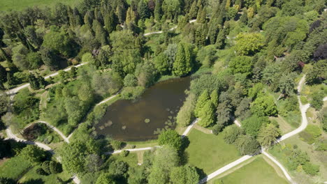 Aerial-of-large-pond-in-beautiful-green-park