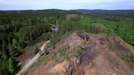 Deserted-Mine,-Lake-and-Forest,-Bergslagen,-Sweden,-Industrial-Heritage,-Circling-Aerial