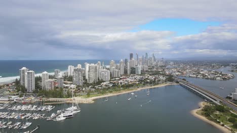 Aerial-View-Of-Boats-Docked-At-Marina-Mirage-Ferry-Terminal---High-rise-Hotels-And-Apartments-Buildings-At-Main-Beach-In-Gold-Coast,-QLD,-Australia