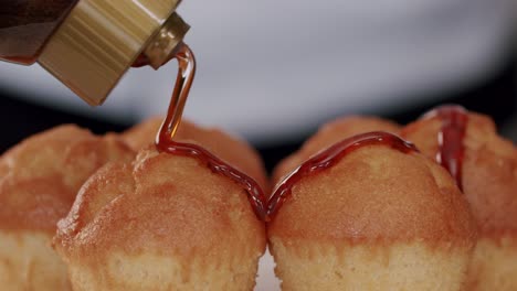 Pouring-Syrup-Over-Cupcakes---close-up