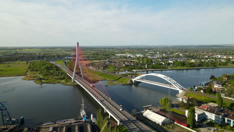 Aerial-View-Of-Third-Millennium-John-Paul-II-Bridge-And-Railway-Bridge-Over-Martwa-Wisla-River-In-Gdansk,-Poland
