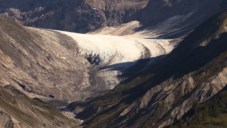 Remnants-of-a-once-large-Glacier-in-between-mountains-of-Alaska