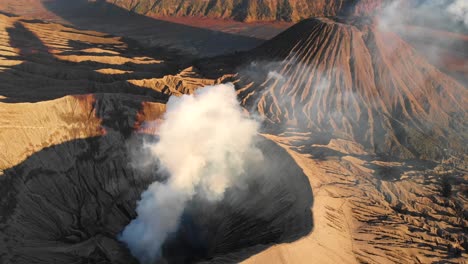 Golden-hour-in-morning-at-active-volcano-Bromo-in-Java,-aerial