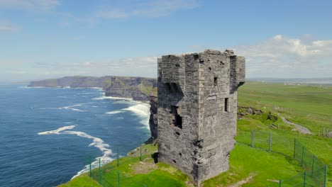 Aerial-reveal-footage-of-Cliffs-of-Moher-while-moving-away-from-Moher-Tower
