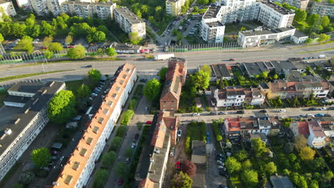 Drone-shot-at-the-old-town-and-modern-buildings-divided-with-highway-road-in-Gdansk,-Poland