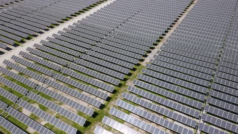 Aerial-View-of-Solar-Panel-Farm-Producing-Clean-Green-Renewable-Energy-to-Power-Nearby-City-and-Reduce-the-Impacts-of-Climate-Change