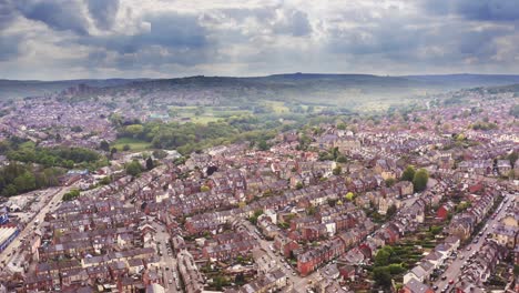 Beautiful-aerial-shot-over-a-typical-British-countryside-town-in-overcast-cloud