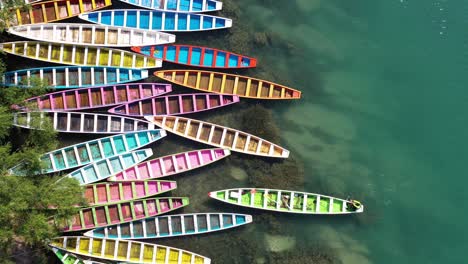 Colourful-boats-parking-in-Tamasopo-River,-San-Luis-Potosi,-Mexico