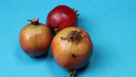 Ripe-pomegranate-on-color-background,-top-view