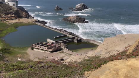 Iconic-Landmark-Sutro-Baths-on-a-Sunny-and-Calm-Day-along-the-Pacific-Coast-in-San-Francisco,-California