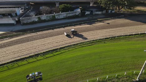 Soil-compactor,-packing-the-soil-tightly-before-horse-racing-at-the-race-course