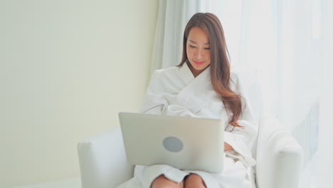 Working-from-anywhere,-even-a-hotel-room,-and-wearing-a-fluffy-robe,-can-be-accomplished-with-a-laptop-ad-a-good-internet-connection