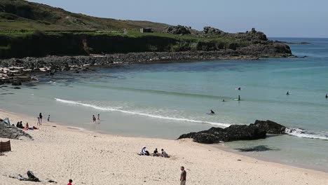 HD-St-Ives-in-Cornwall-at-Porthmeor-Beach-with-people-sunbathing-and-enjoying-the-summer-life-in-England