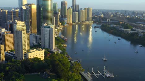 Revealing-Aerial-view-of-Brisbane-City-CBD-Highrise-buildings-with-Glowing-Morning-light,-QLD,-Australia