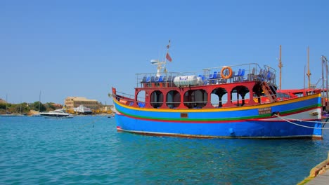 One-of-the-many-colorful-tour-boats-of-the-Grand-Harbor-Valletta-Malta