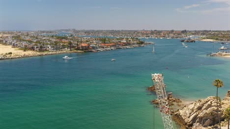 Aerial-view-of-a-crane-on-the-edge-of-the-Newport-Beach-channel