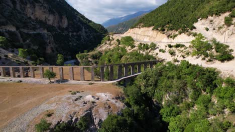 Old-aqueduct-on-Vjosa-river-branch,-beautiful-landscape,-Roman-architecture-in-Albania