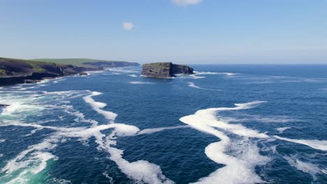 Aerial-view-of-Kilkee-Cliffs-while-going-towards-Illaunonearaun-Natural-Heritage-Area-islet