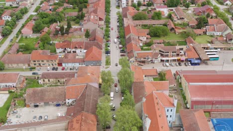 Aerial-shot-flying-along-a-street-in-Novi-Sad,-Serbia-in-a-residential-area